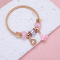 Bracelet Jonc Doré avec Charm's Papillon et Coquillage | Princessdz