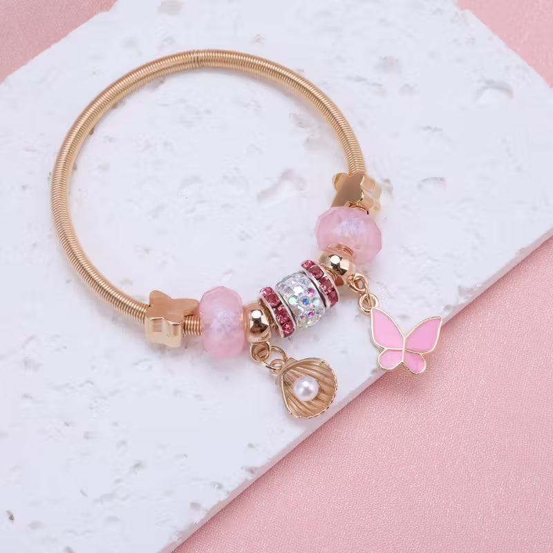 Bracelet Jonc Doré avec Charm's Papillon et Coquillage | Princessdz